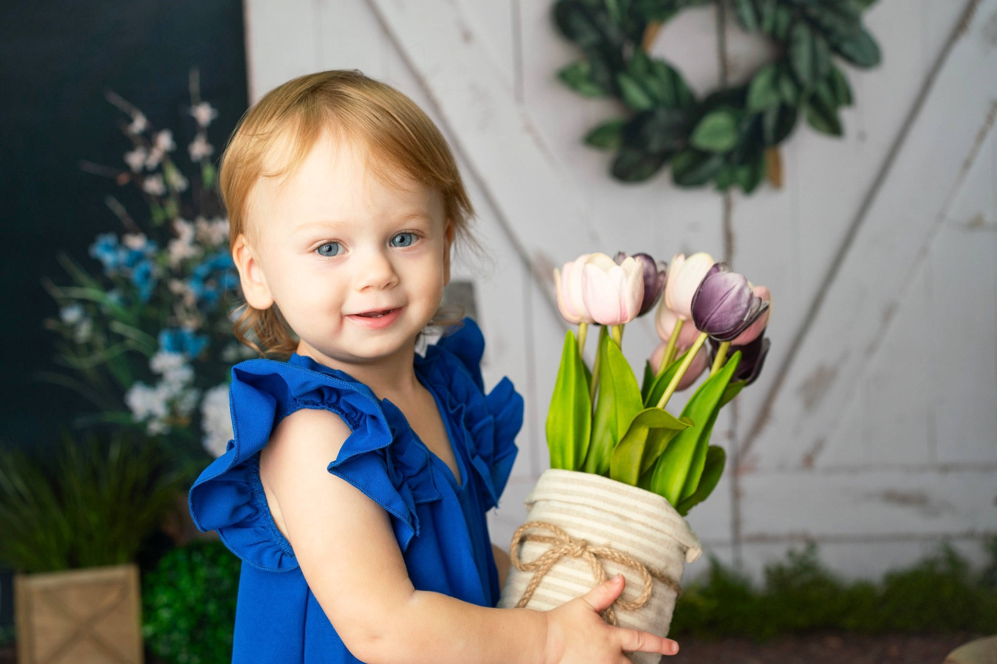 Lacey Lynne is registered to the contest to win money with this photo: arm, child, electric_blue, eye, facial_expression, flower, flower_arranging, gesture, grass, happy, iris, joy, leisure, people, people_in_nature, person, petal, photograph, plant, smile