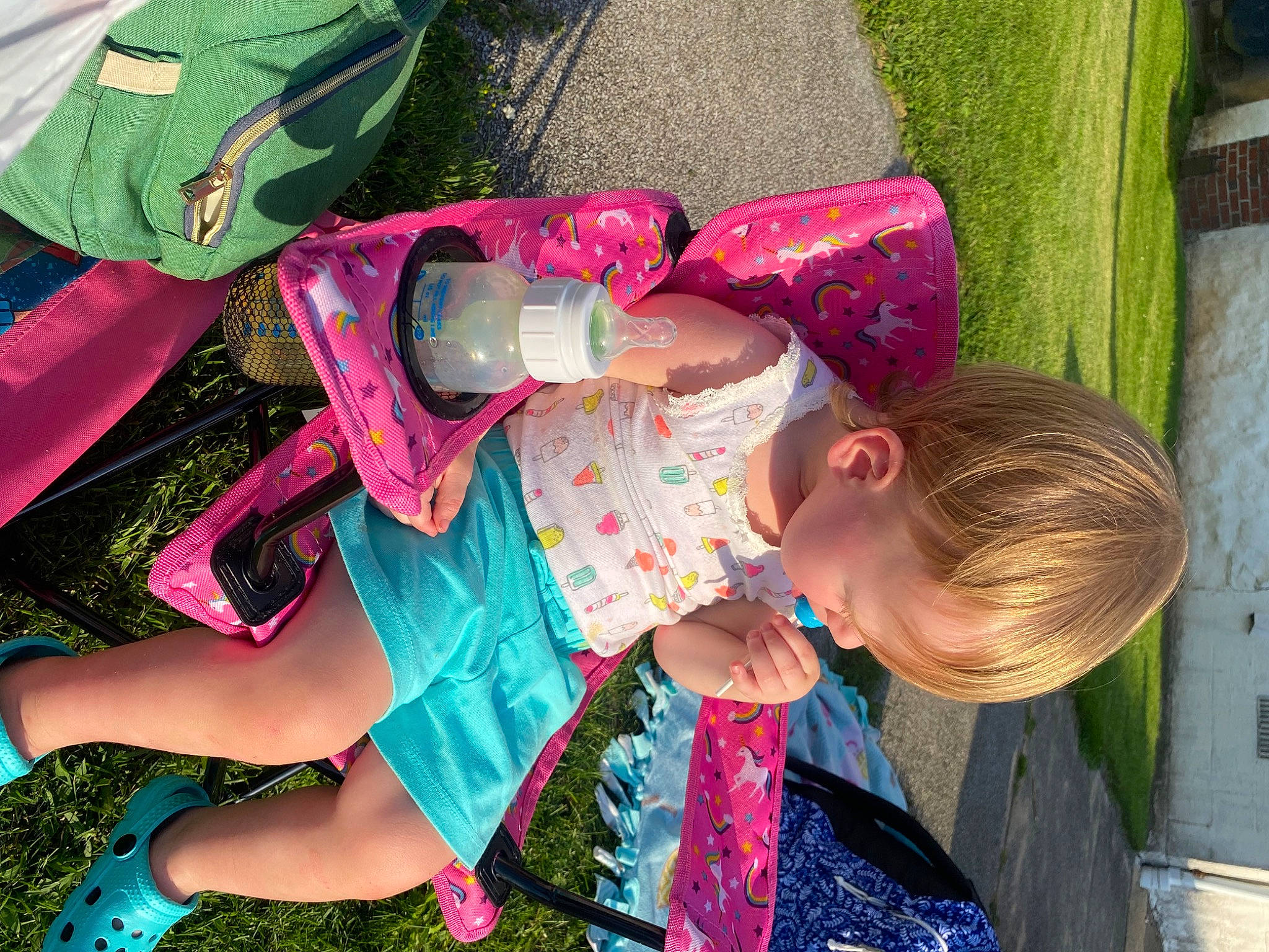 Lacey Lynne is registered to the contest to win money with this photo: baby_toddler_clothing, child, fun, grass, green, happy, human_leg, leisure, magenta, pattern, people_in_nature, person, pink, play, recreation, red, sandal, shorts, summer, t_shirt