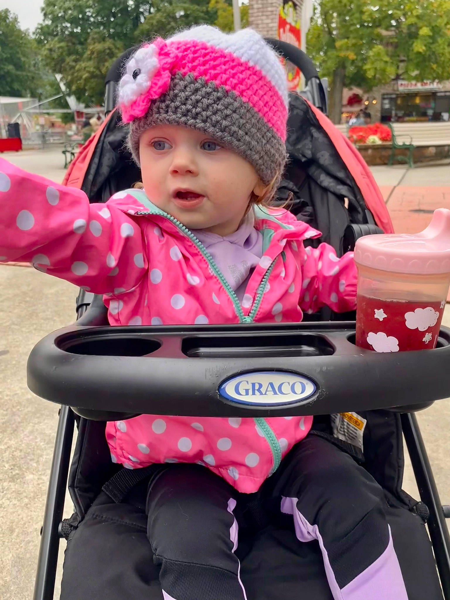 Lacey joined the competition — help win amazing prizes! baby, baby_carriage, baby_products, baby_toddler_clothing, cap, child, event, fun, headwear, knit_cap, leisure, magenta, people, person, personal_protective_equipment, pink, product, recreation, sitting, toddler