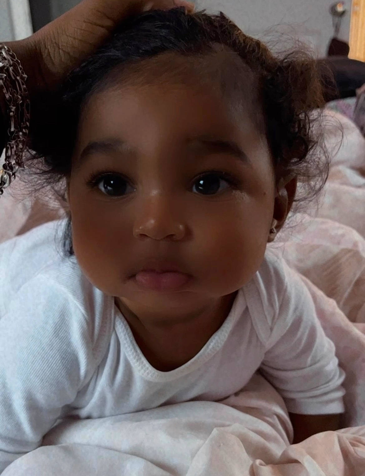 Amiri is registered to the contest to win money with this photo: arm, cheek, chin, ear, eye, eyebrow, eyelash, face, facial_expression, forehead, hair, hairstyle, hand, head, lip, mouth, neck, nose, person, skin