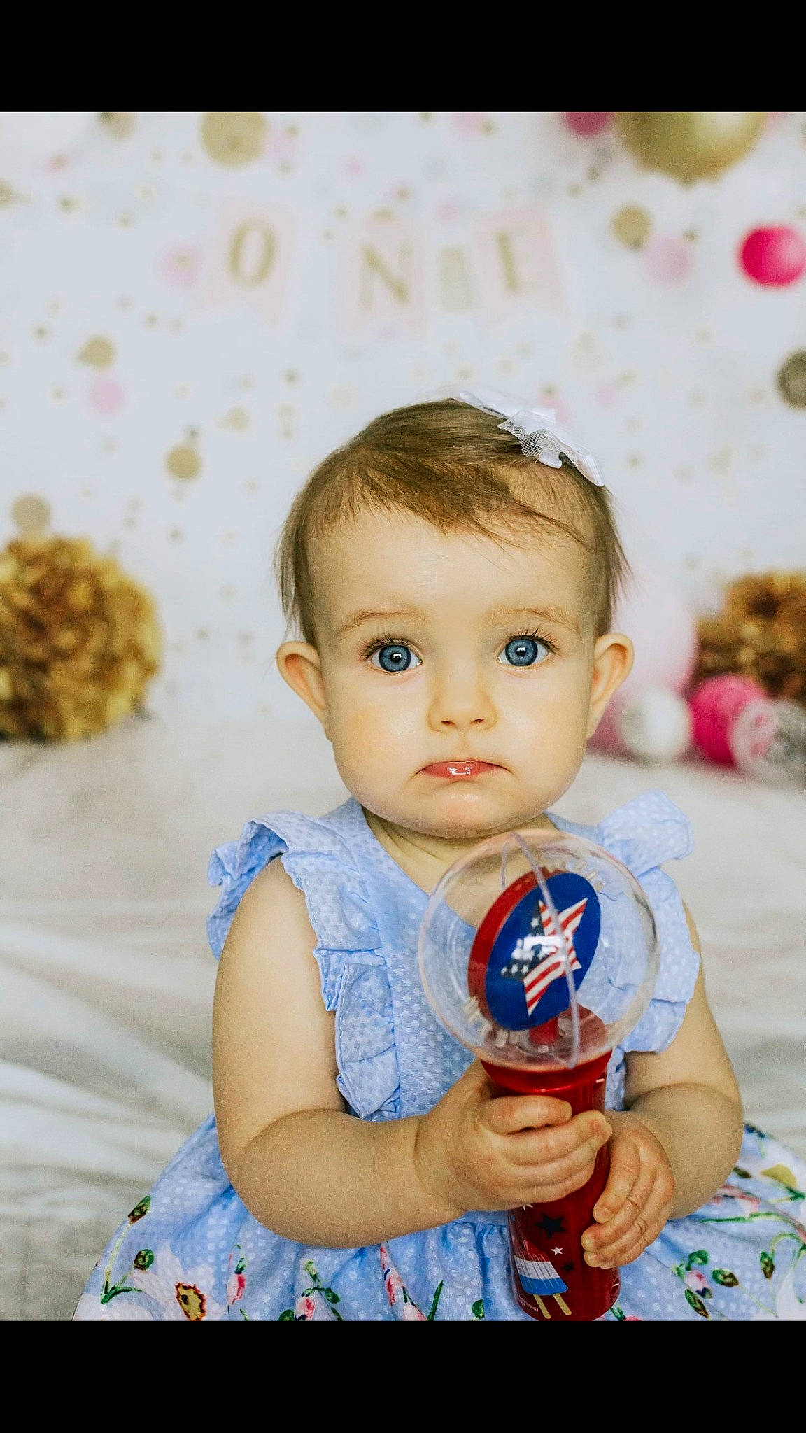 Rosanna is registered to the contest to win money with this photo: azure, baby, baby_toddler_clothing, blond, child, electric_blue, fun, grass, happy, iris, leisure, pattern, people_in_nature, person, pink, play, product, skin, sleeve, t_shirt