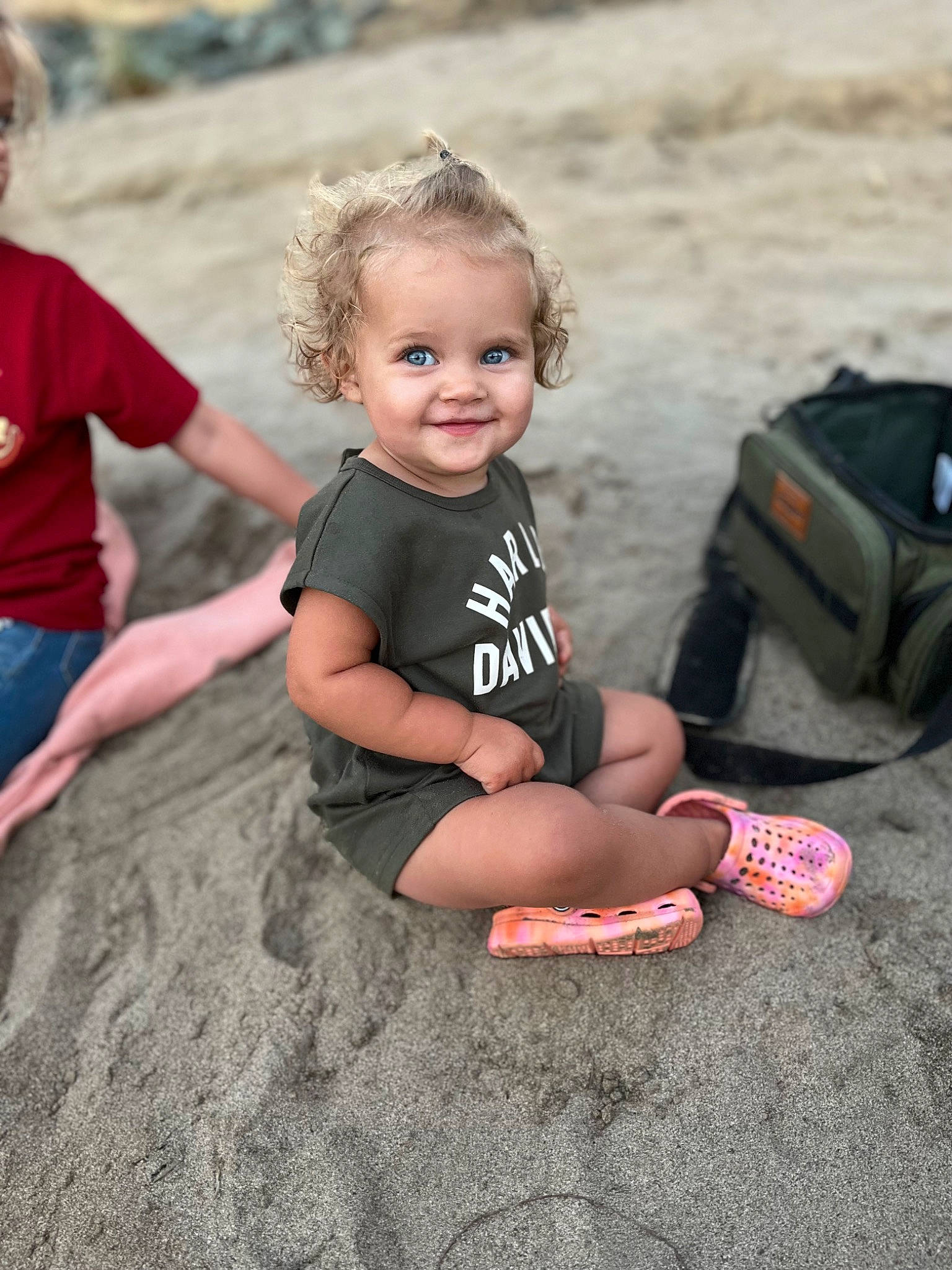 Rylee joined the competition — help win amazing prizes! automotive_tire, bag, child, flash_photography, fun, grass, happy, joy, landscape, leisure, luggage_and_bags, people_in_nature, person, play, recreation, sand, shorts, sitting, smile, soil