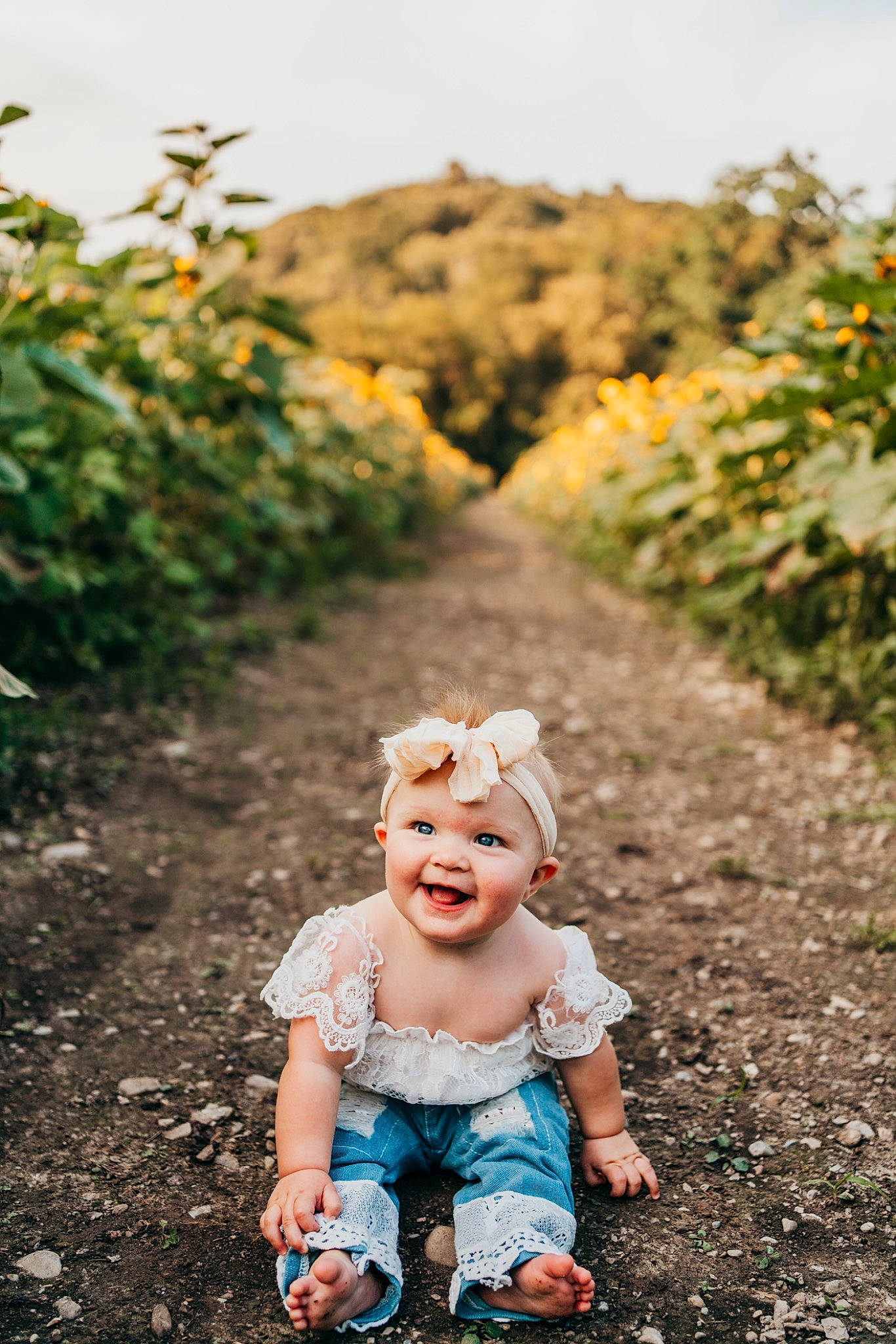 Madilyn joined the competition — help win amazing prizes! agriculture, asphalt, baby, field, garden, grass, grassland, happy, headgear, headwear, joy, landscape, leisure, people_in_nature, person, plant, recreation, road, shrub, sky