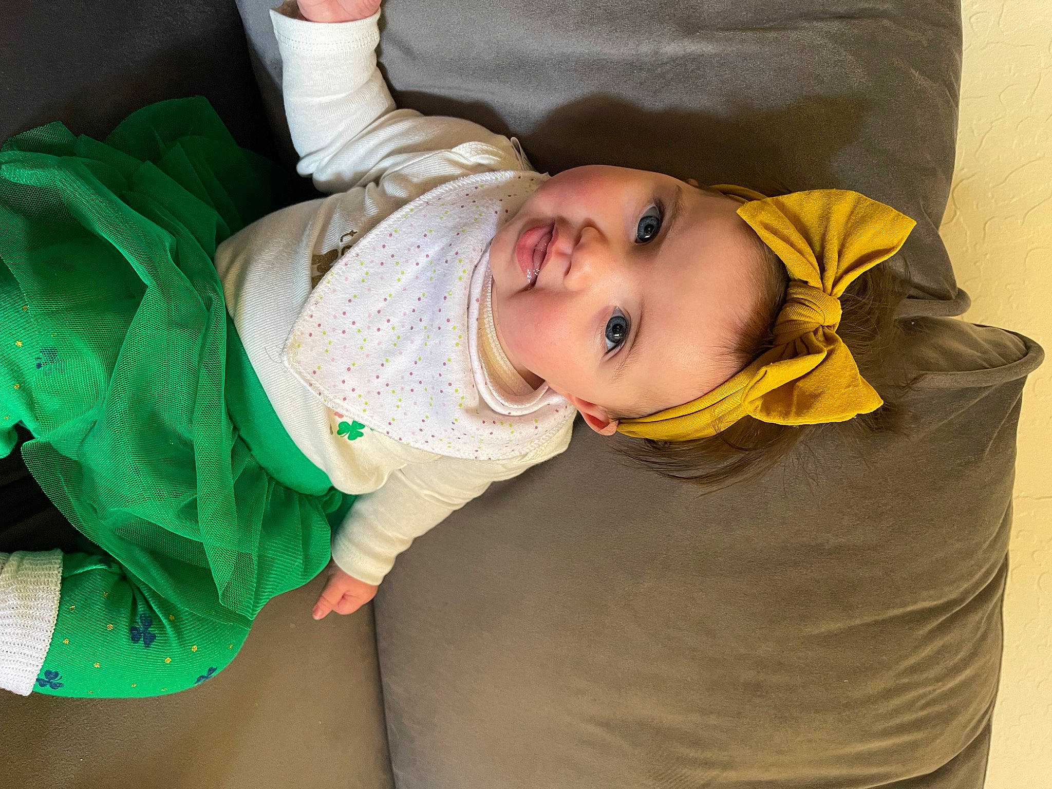 Mia is registered to the contest to win money with this photo: baby, baby_products, baby_toddler_clothing, cheek, child, comfort, elbow, fun, grass, happy, human_leg, iris, mouth, person, sitting, skin, sleeve, smile, thigh, toddler