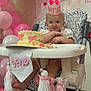 Evelyn joined the competition — help win amazing prizes! baby, birthday, cake, high_chair, pink, crown, balloons, celebration, smile, child, party, decorations, frosting, one_year_old, tassels, festive, cute, indoors, first_birthday, happy