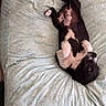 Bruno is registered to the contest to win money with this photo: puppy, dog, lying_down, bed, blanket, pattern, black_and_white, fur, cute, pet, animal, relaxed, indoor, nap, belly_up, paw, young, cozy, resting, soft
