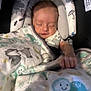 baby, sleeping, blanket, car_seat, infant, cute, peaceful, face, hand, cozy, child, resting, soft, animal_print, comfort, indoors, portrait, newborn, clothing, head_support