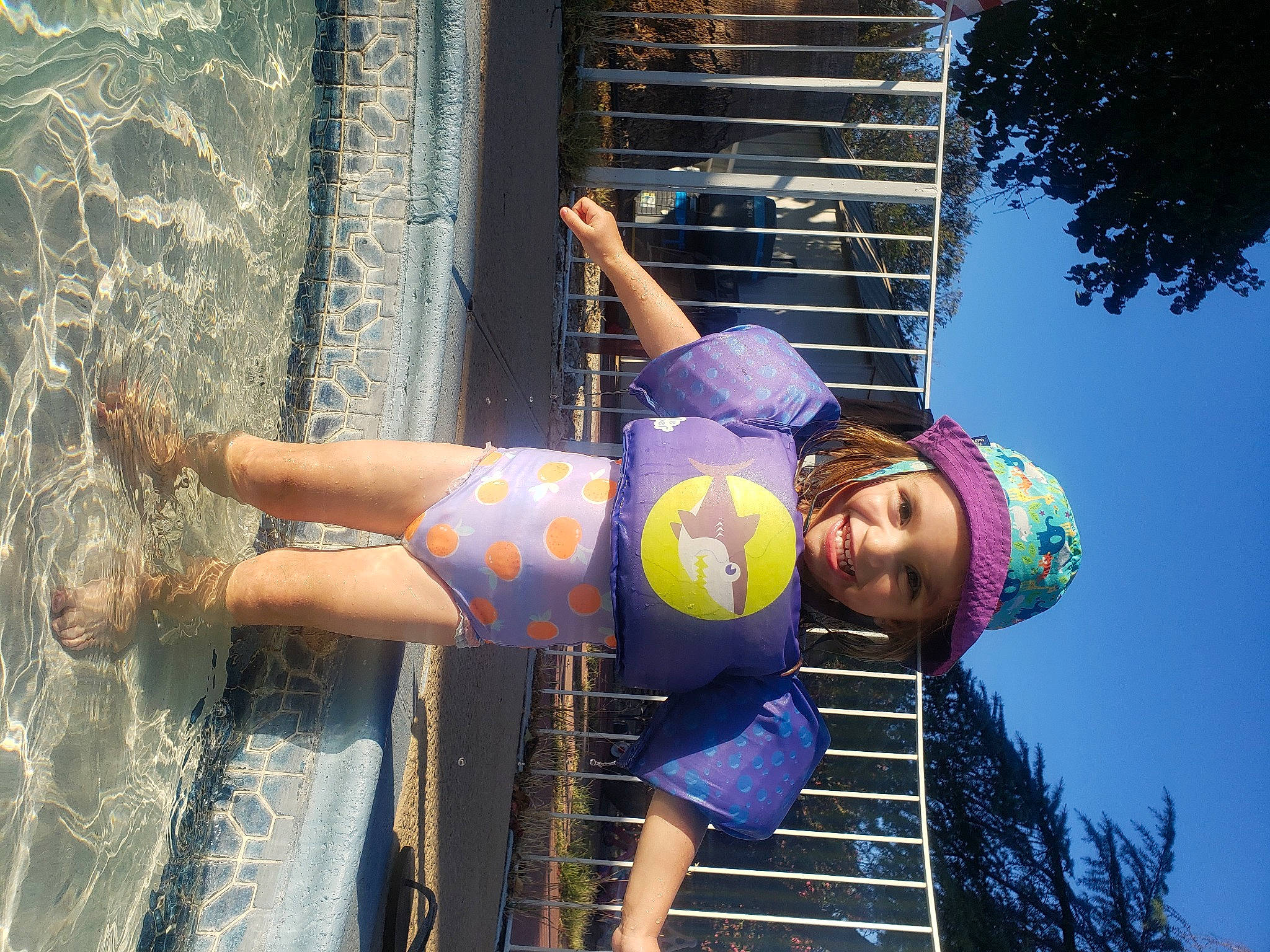 Serenity is registered to the contest to win money with this photo: child, elbow, electric_blue, fun, happy, hat, headwear, human_leg, joy, leisure, light, person, recreation, shorts, sky, smile, t_shirt, thigh, tree, vacation