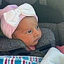 Sahara is registered to the contest to win money with this photo: baby, car_seat, pink_hat, white_bow, blanket, striped_blanket, infant, child, newborn, cute, cozy, seatbelt, safety, portrait, face, clothing, headwear, indoor, resting, young