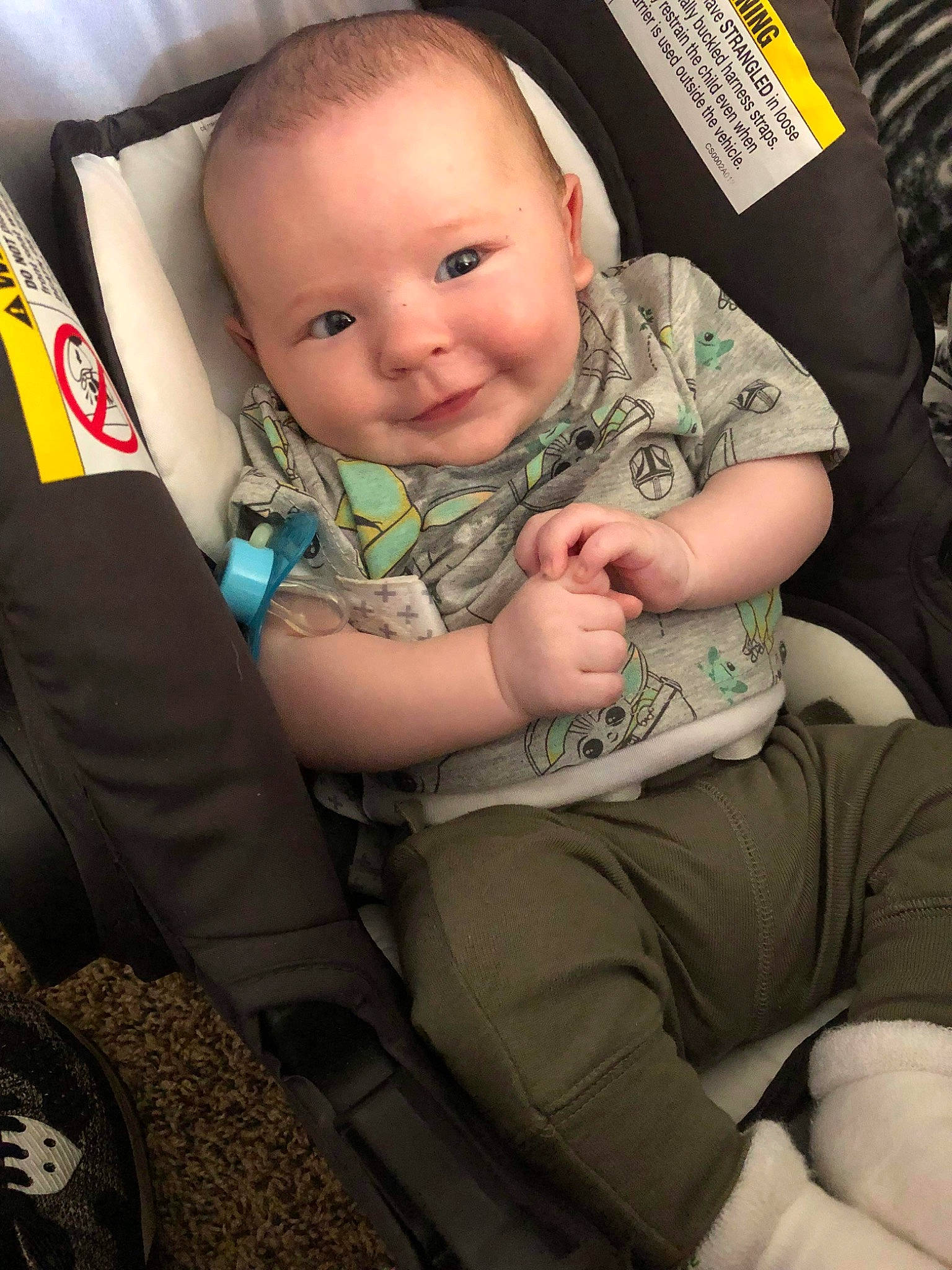 Karson is registered to the contest to win money with this photo: baby, baby_toddler_clothing, car_seat, cheek, child, comfort, cool, eye, facial_expression, fun, head, human_body, lap, leg, person, seat_belt, sitting, skin, smile, thigh