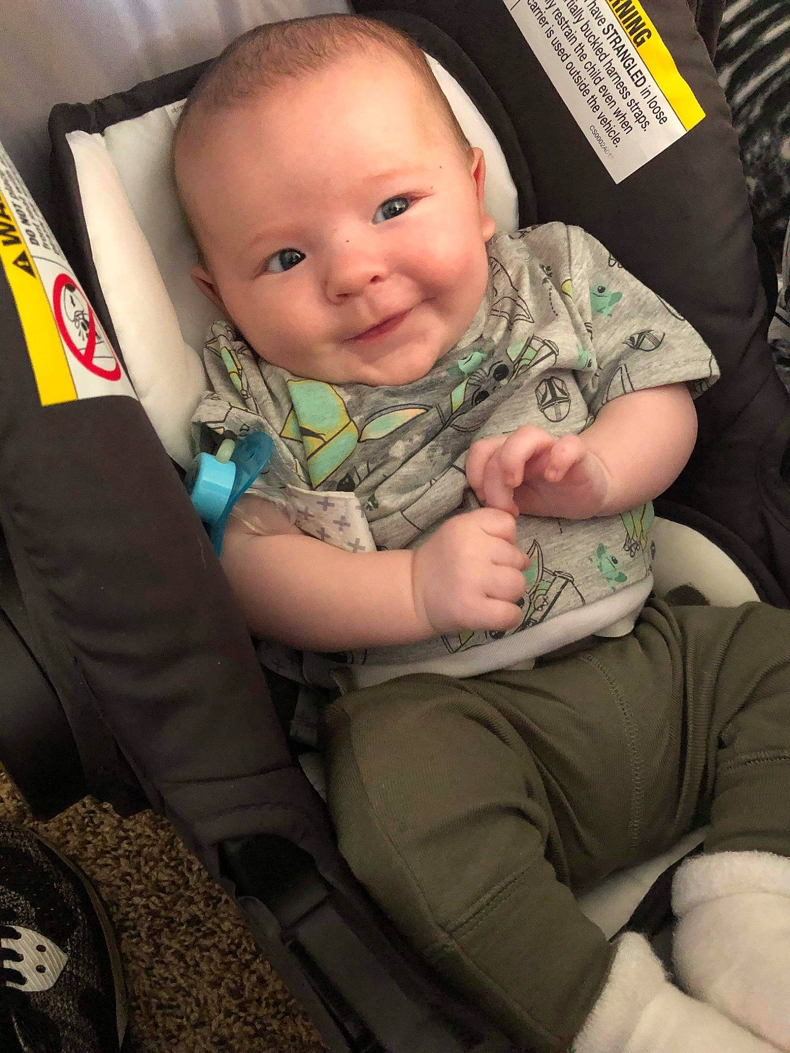 Karson joined the competition — help win amazing prizes! arm, auto_part, baby, baby_carriage, baby_toddler_clothing, car_seat, cheek, comfort, eye, finger, gesture, hand, head, lap, person, seat_belt, sitting, skin, smile, thigh
