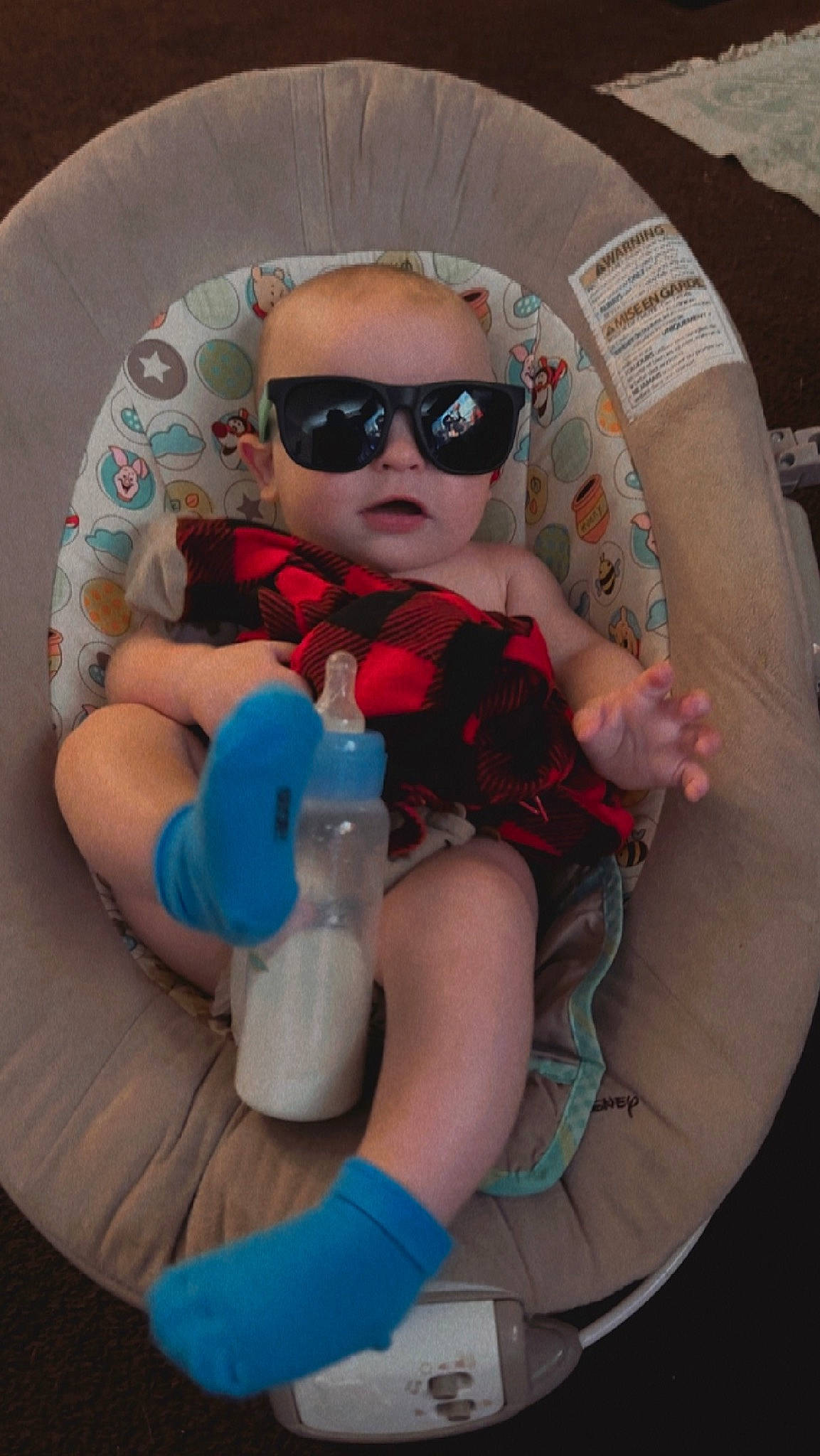 Karson is registered to the contest to win money with this photo: arm, baby, baby_toddler_clothing, doll, drinkware, eyewear, face, finger, fun, glasses, goggles, hand, human_body, person, plastic_bottle, sunglasses, thigh, toddler, toy, vision_care