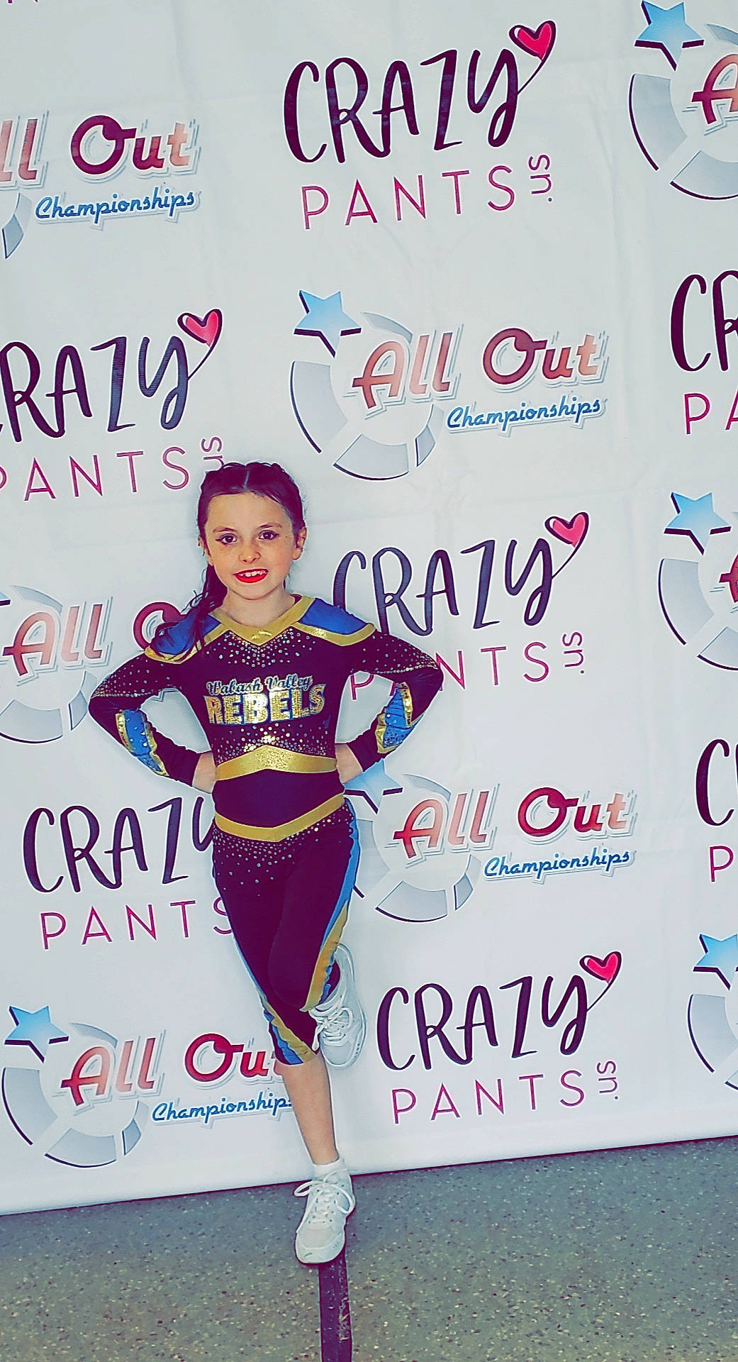 Dallas is registered to the contest to win money with this photo: advertising, competition, electric_blue, entertainment, event, face, fashion_design, flooring, font, happy, high_heels, joy, logo, performing_arts, person, poster, recreation, sleeve, sportswear, t_shirt