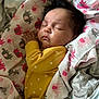 Vada joined the competition — help win amazing prizes! baby, sleeping, blanket, yellow_onesie, polka_dots, elephant_pattern, soft_fabric, infant, cute, peaceful, face, hand, bed, cozy, nap, newborn, child, resting, indoors, portrait