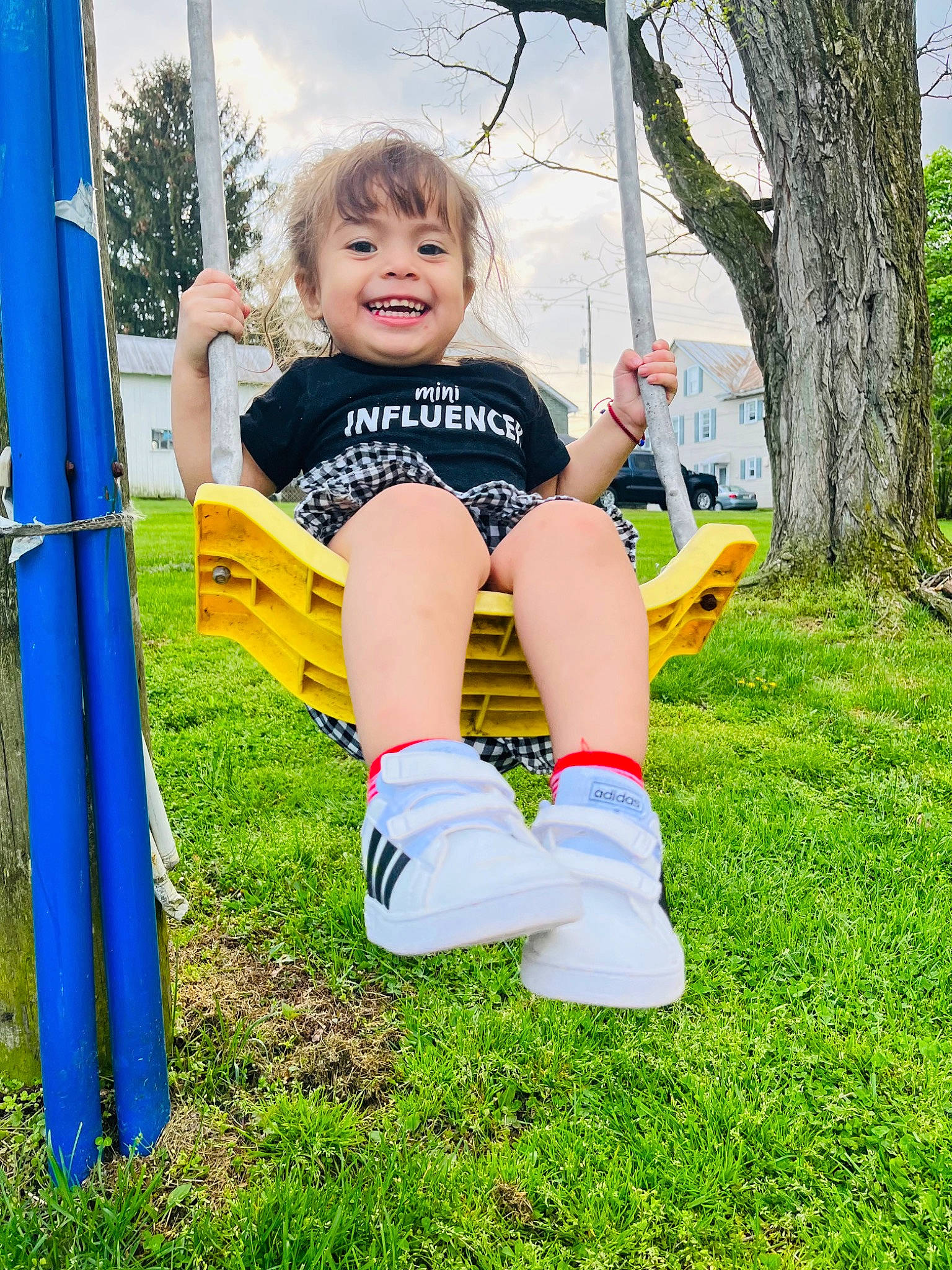 Maddie joined the competition — help win amazing prizes! baby_toddler_clothing, blue, child, eye, face, fun, grass, happy, joy, leisure, outdoor_play_equipment, people_in_nature, person, plant, playground, recreation, shorts, sky, smile, t_shirt