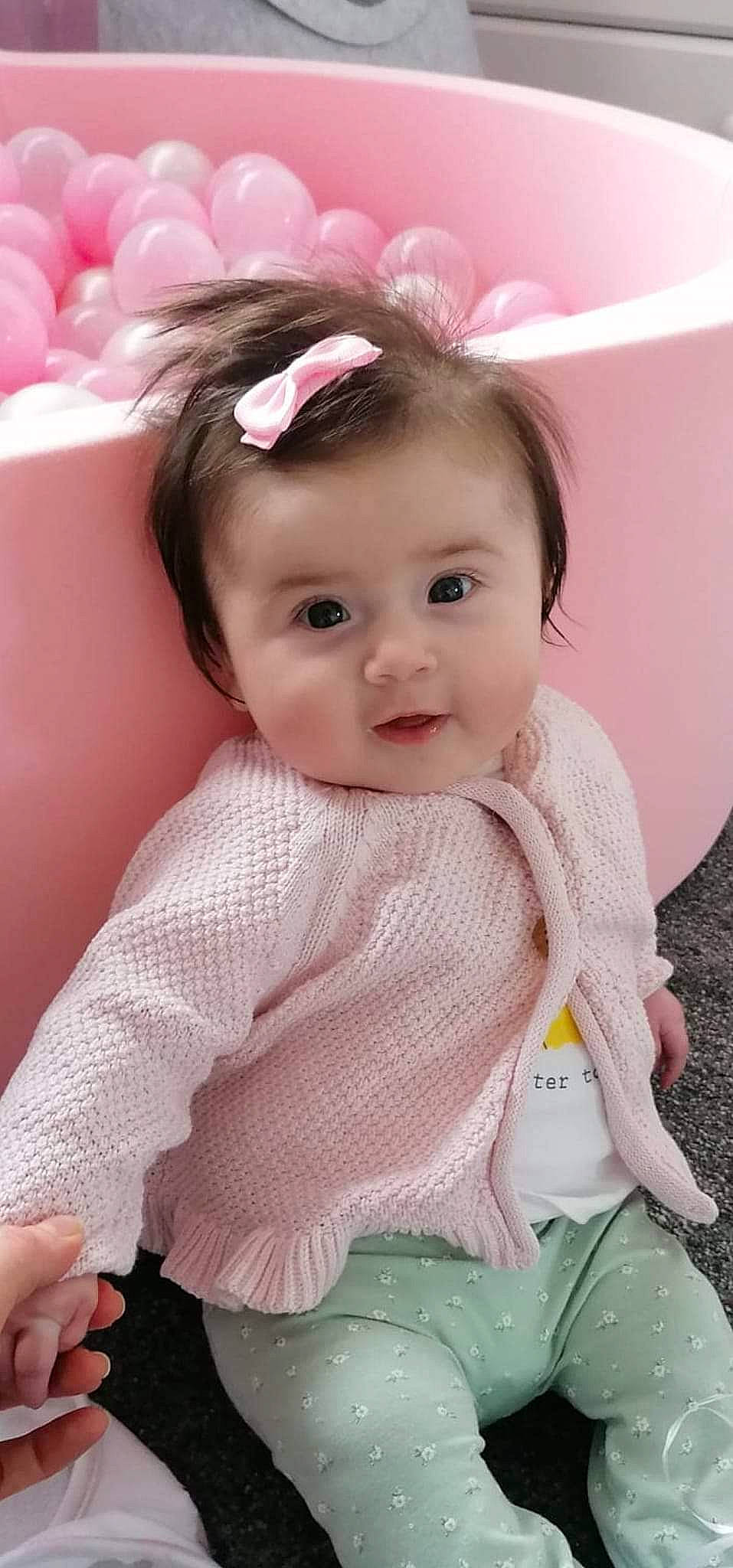 Ava joined the competition — help win amazing prizes! baby, baby_toddler_clothing, cheek, chin, dress, eye, eyebrow, eyelash, happy, head, headgear, iris, lip, person, petal, pink, product, skin, sleeve, smile