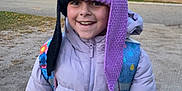 Ember joined the competition — help win amazing prizes! cap, child, city, clothing, coat, face, female, girl, hat, head, hood, jacket, knitwear, person, photography, plant, portrait, road, sweater, tree