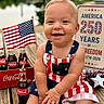 american_flag, baby, bottle, celebration, child, clothing, coca_cola, cute, drink, happy, holiday, outdoor, patriotic, person, portrait, red_white_blue, smile, star, summer, wooden_deck