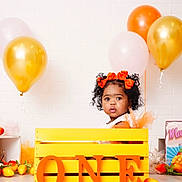 Maysia is registered to the contest to win money with this photo: balloon, birthdaycake, box, child, clothing, face, female, fun, girl, happy, hat, head, party, people, person, photography, portrait, smile, sphere, wood