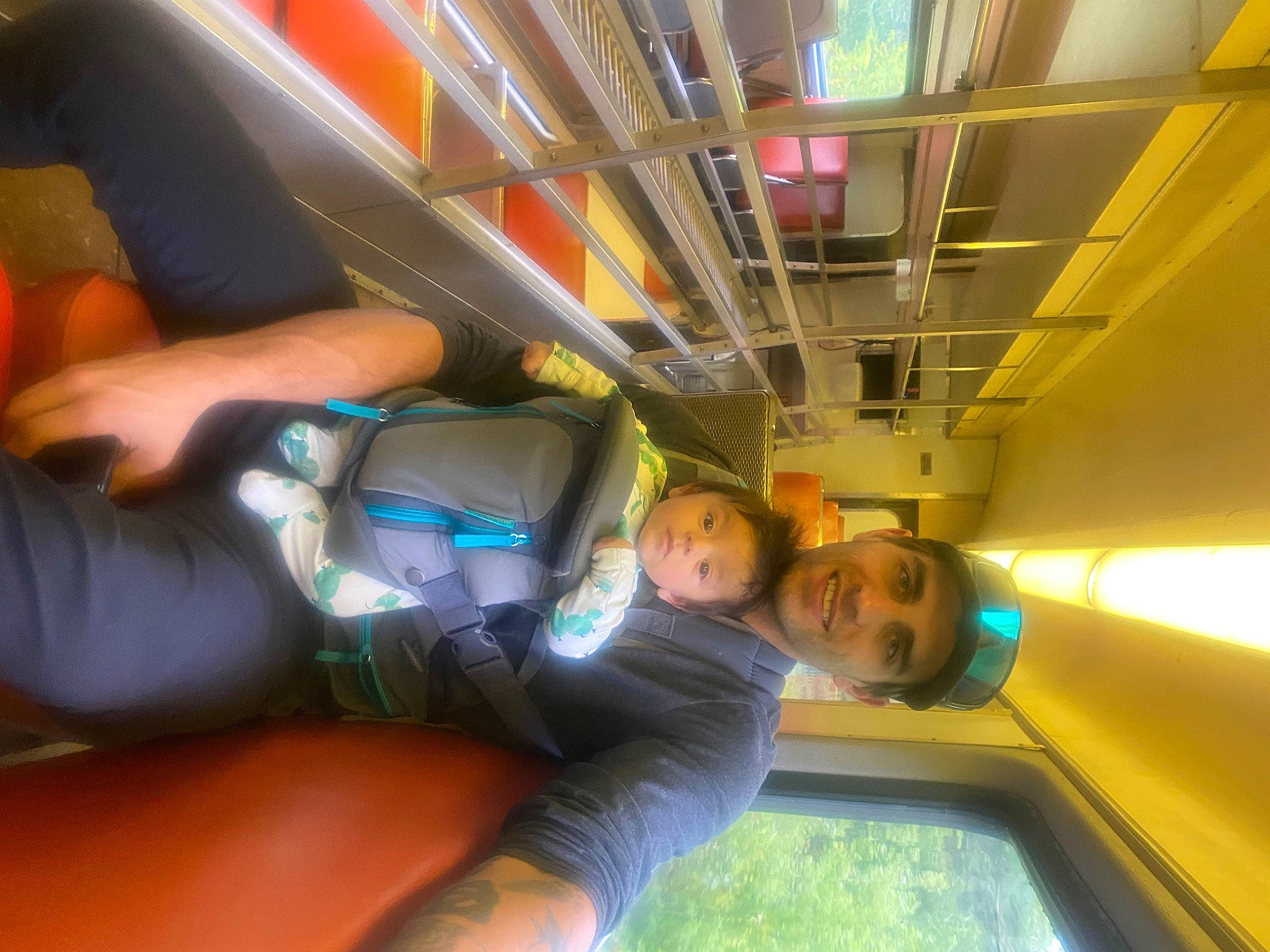 Colby joined the competition — help win amazing prizes! air_travel, automotive_window_part, comfort, elbow, fun, headwear, human_leg, joy, knee, leisure, passenger, person, public_transport, sitting, smile, t_shirt, thigh, train, transport, travel