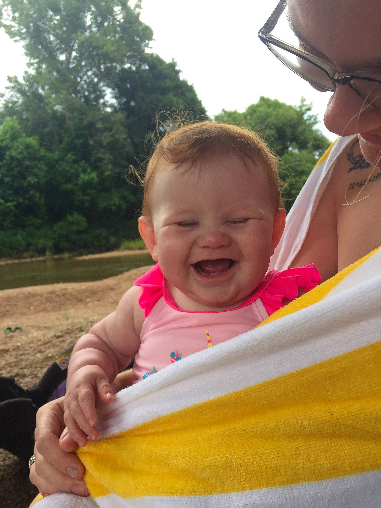 Debra is registered to the contest to win money with this photo: baby, baby_toddler_clothing, face, facial_expression, finger, fun, gesture, grass, happy, joy, leisure, lip, mouth, people_in_nature, person, recreation, skin, sky, smile, toddler