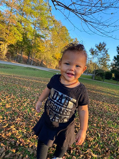 Kaya is registered to the contest to win money with this photo: baby, baby_toddler_clothing, child, deciduous, grass, happy, joy, landscape, leaf, leisure, people_in_nature, person, plant, sky, sleeve, smile, sunlight, tints_and_shades, toddler, tree