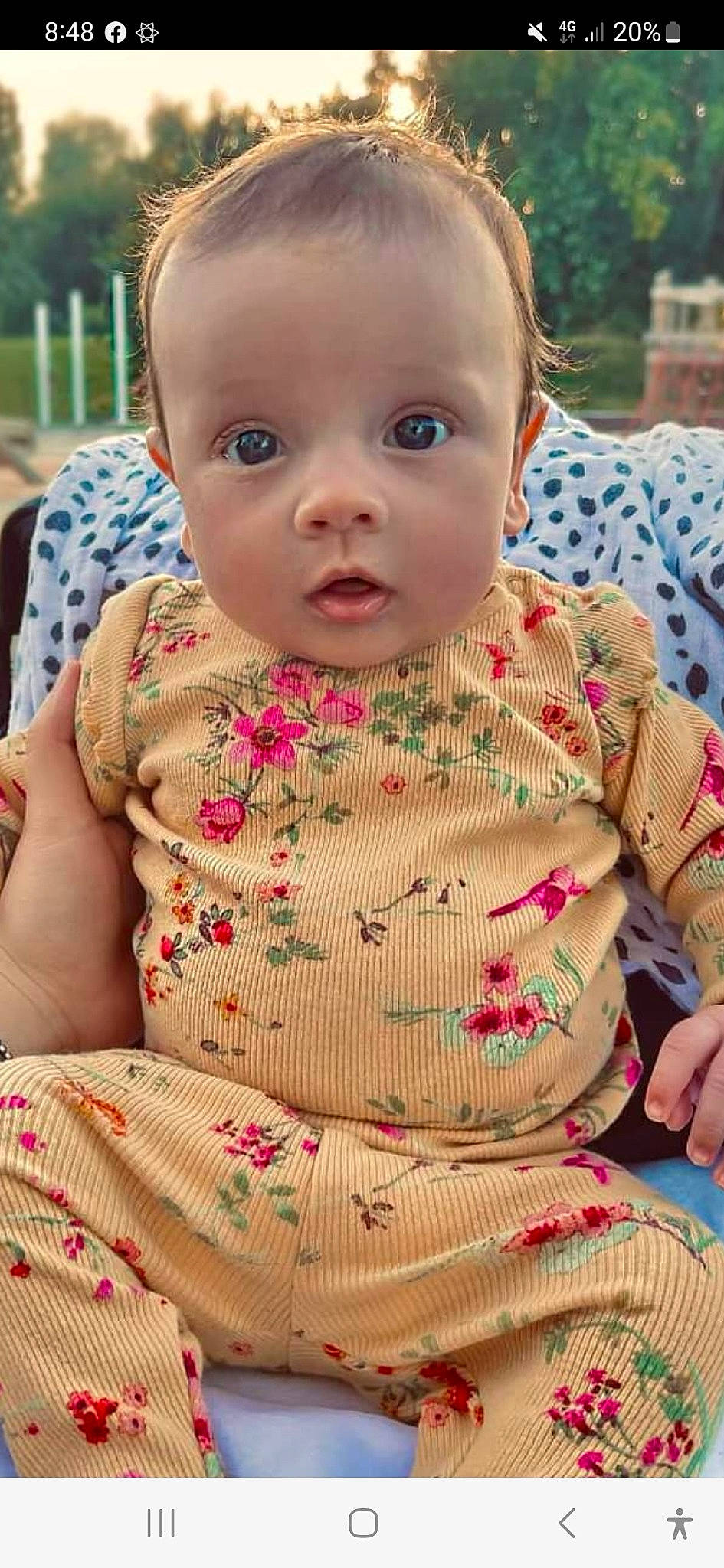 Aria joined the competition — help win amazing prizes! baby, baby_toddler_clothing, cheek, child, eye, grass, head, lip, neck, necklace, nose, pattern, person, pink, plant, sitting, skin, sleeve, surprise, t_shirt