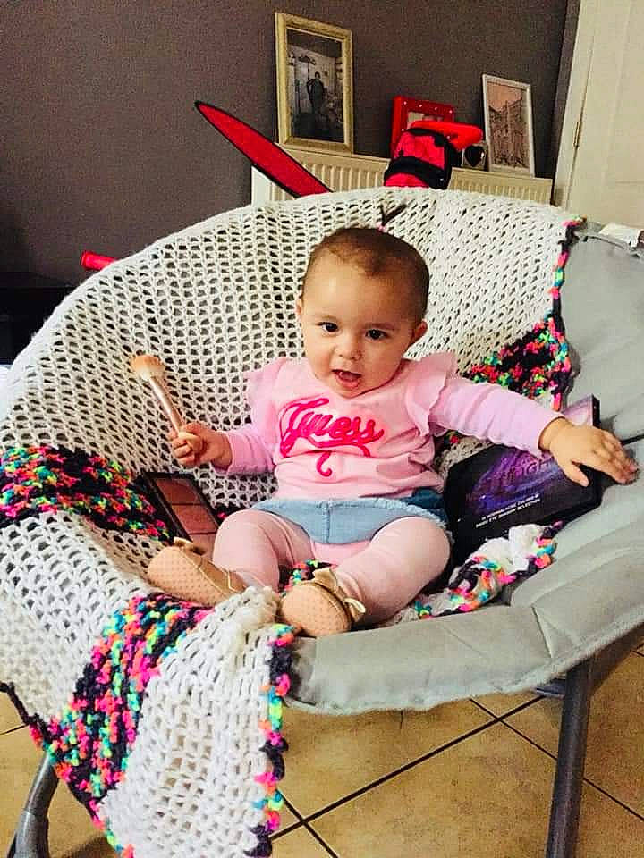 Victoria participe au concours pour gagner de l'argent avec cette photo : baby, chair, child, crochet, furniture, knitting, pattern, person, pink, play, sitting, textile, toddler, wool