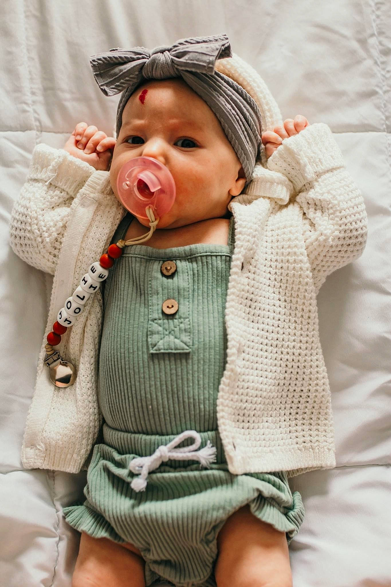 Jolie joined the competition — help win amazing prizes! baby, baby_toddler_clothing, cheek, collar, eye, face, finger, happy, headgear, headwear, human_body, jacket, lip, neck, nose, outerwear, person, skin, sleeve, street_fashion