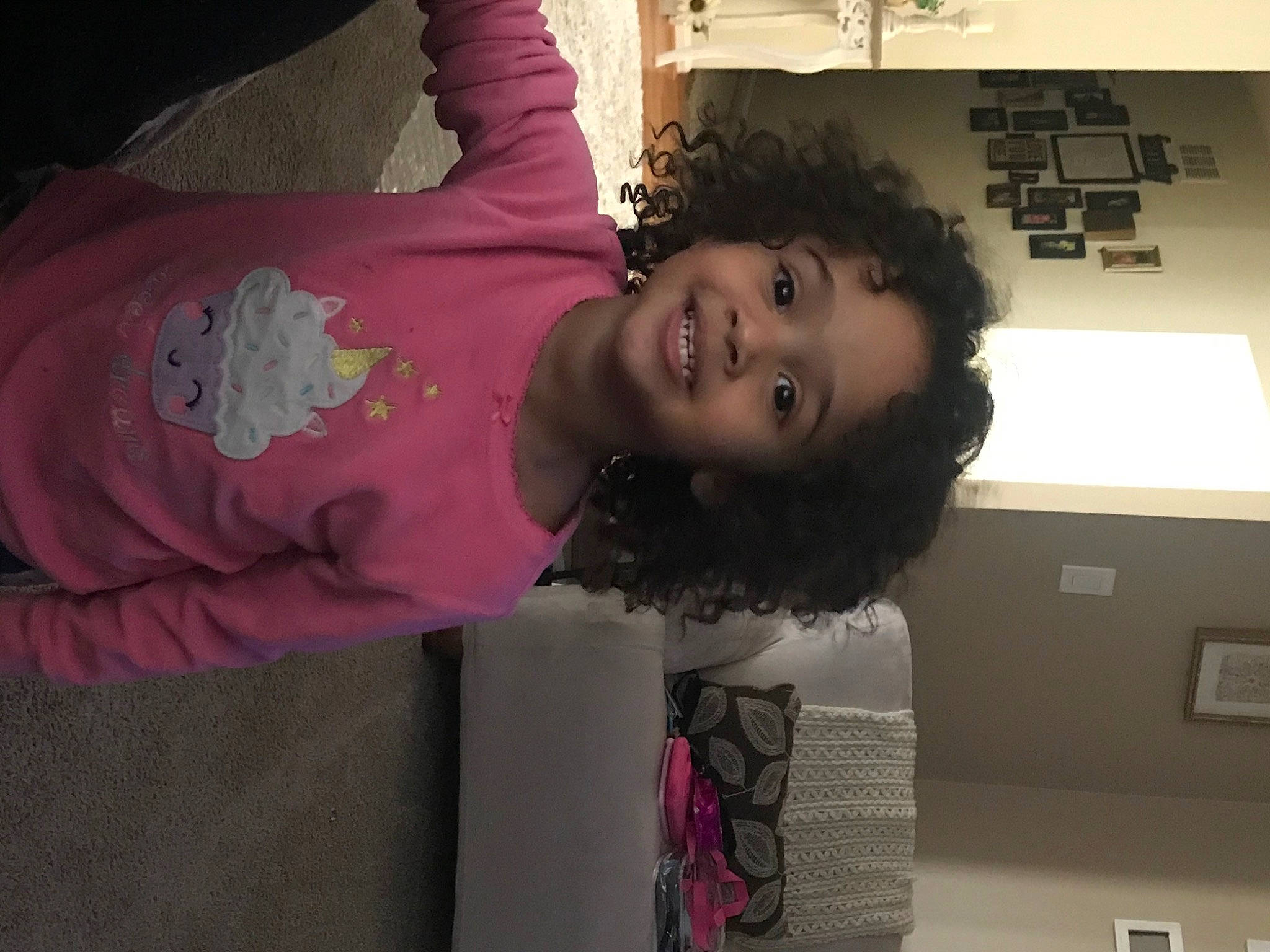 Mia Green is registered to the contest to win money with this photo: baby_toddler_clothing, child, fun, happy, joy, magenta, pattern, person, pink, plant, purple, room, sleeve, smile, standing, t_shirt, toddler, violet