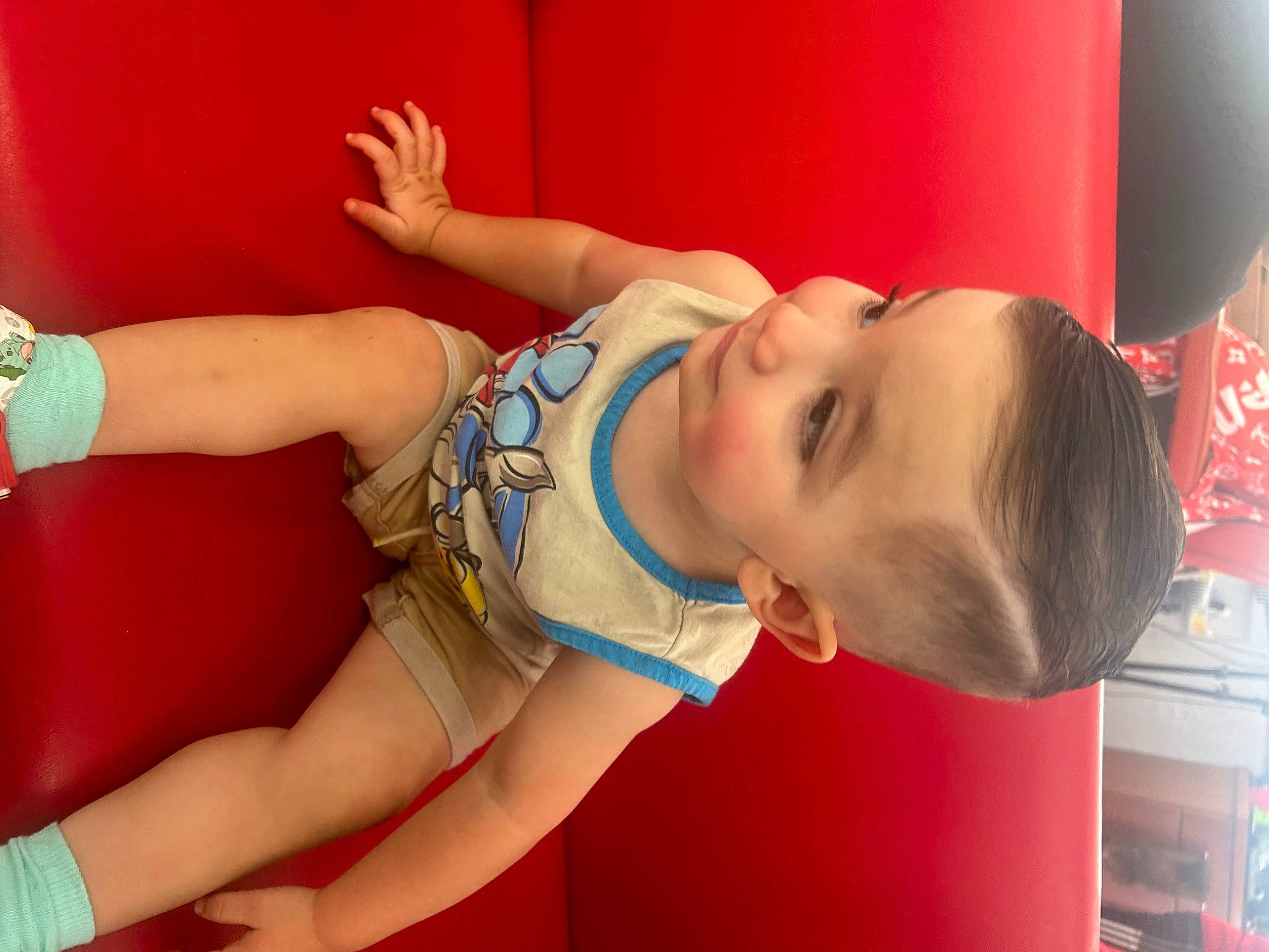 John is registered to the contest to win money with this photo: abdomen, arm, baby, baby_toddler_clothing, chest, child, elbow, fun, happy, human_leg, joint, knee, leisure, mouth, muscle, person, play, skin, thigh, toddler