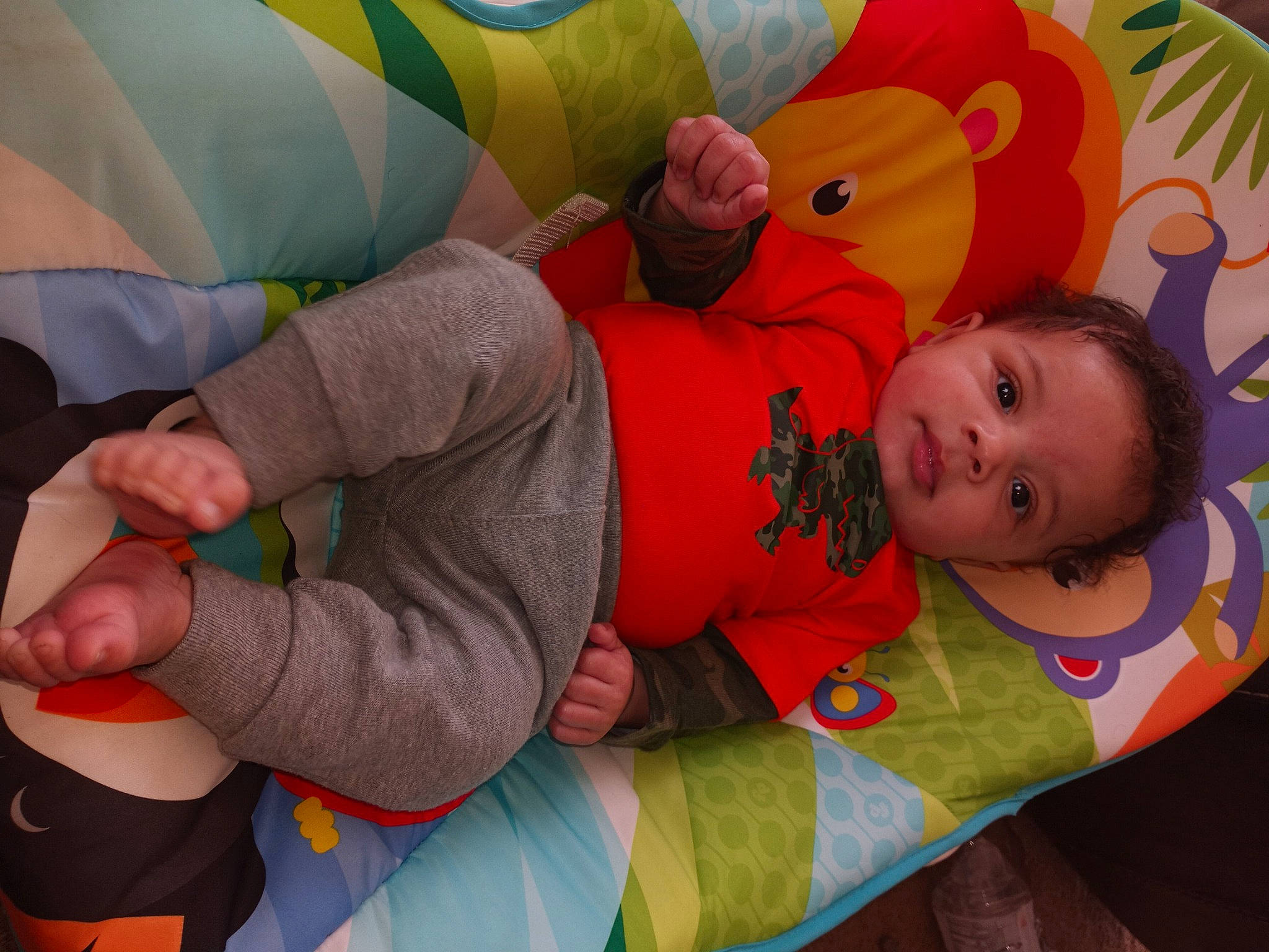 Kajey is registered to the contest to win money with this photo: baby, baby_products, baby_toddler_clothing, child, comfort, fun, gesture, happy, human_body, knee, leisure, linens, orange, pattern, people, person, product, textile, thigh, toddler