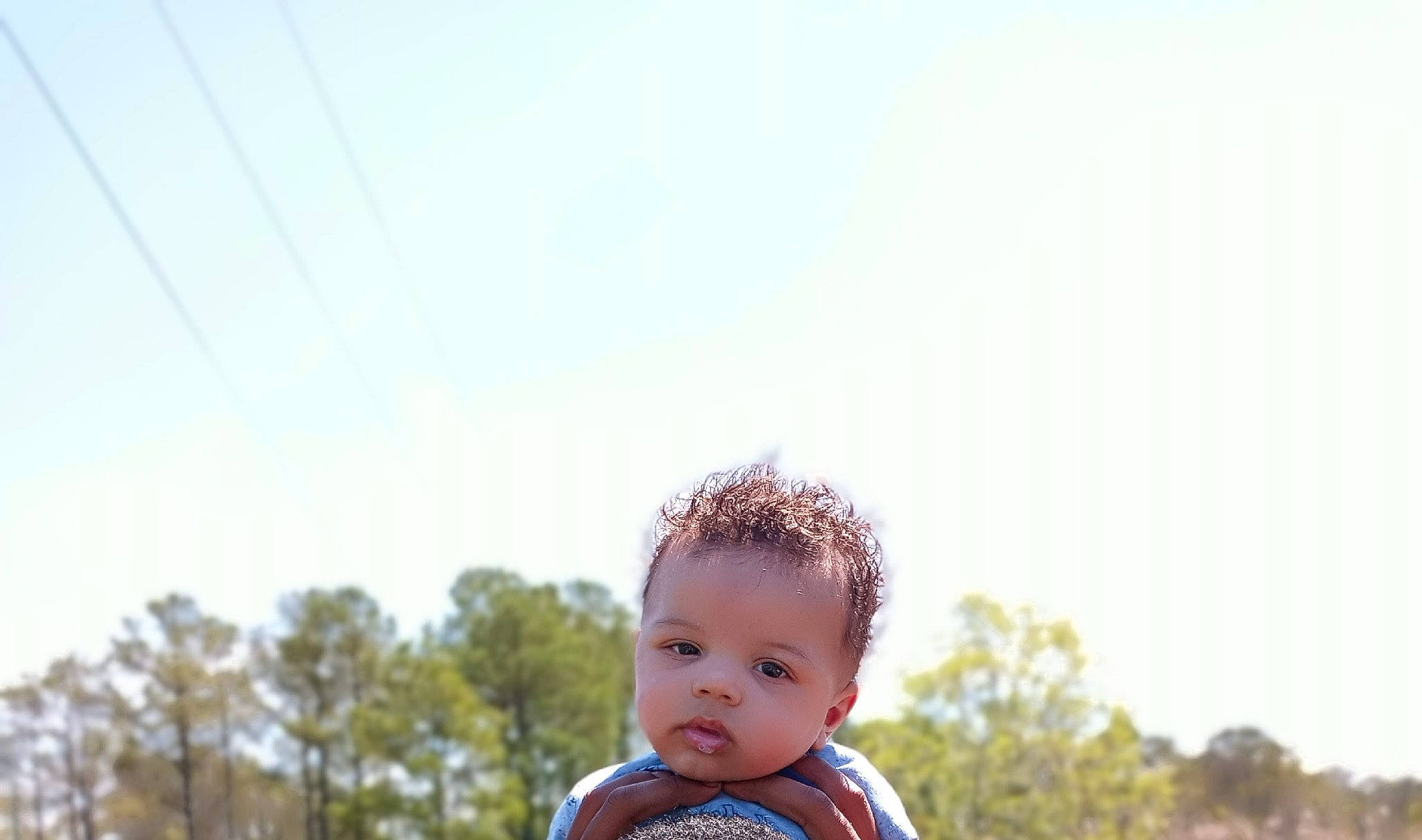 Kajey is registered to the contest to win money with this photo: baby, baby_toddler_clothing, child, cloud, eye, flash_photography, fun, grass, grassland, hair, happy, landscape, leisure, people_in_nature, person, plant, sitting, sky, toddler, tree