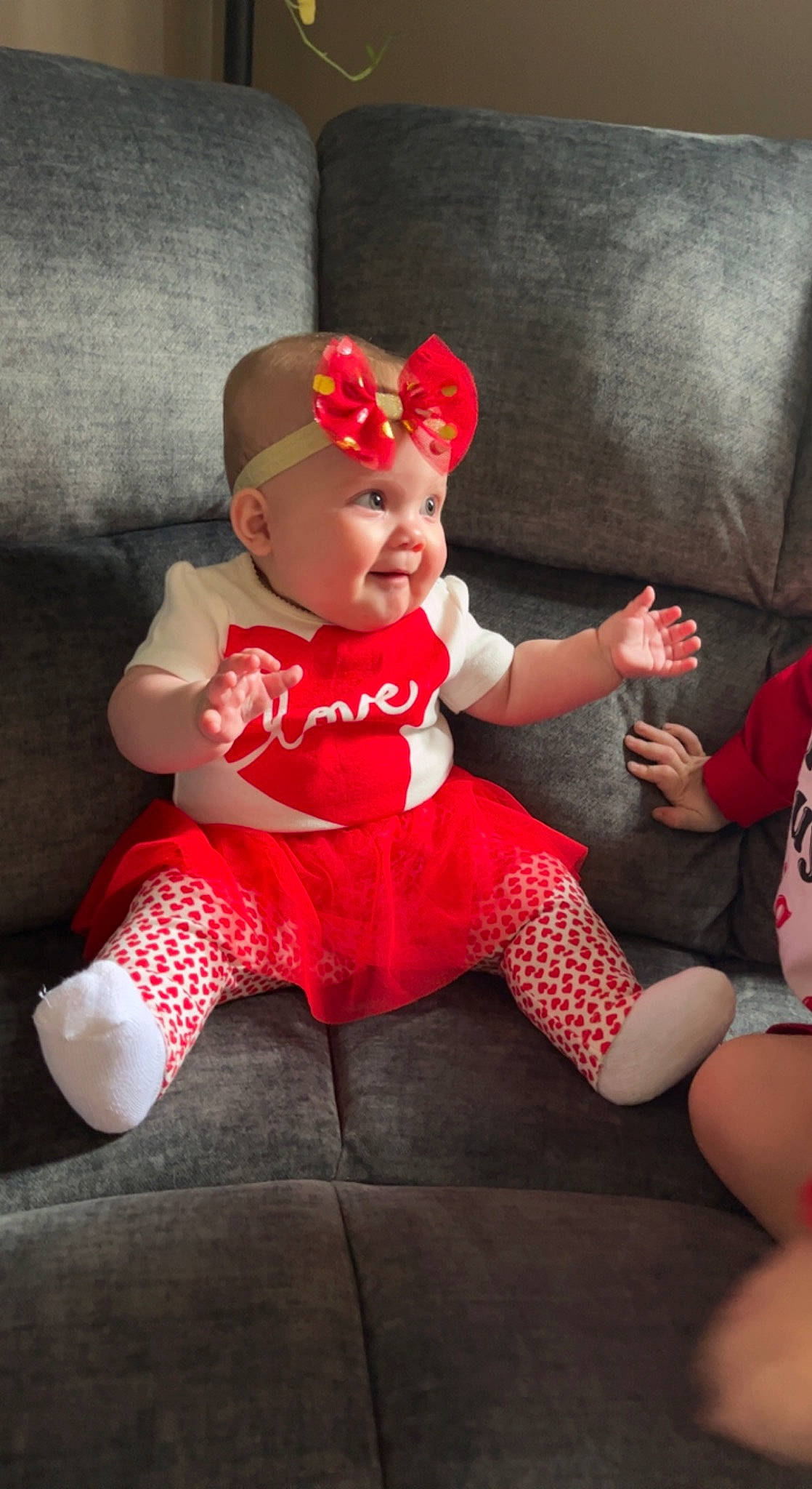 Harper joined the competition — help win amazing prizes! baby, baby_toddler_clothing, carmine, child, comfort, costume_hat, event, fictional_character, foot, fun, happy, hat, headwear, human_leg, lap, person, pink, sitting, sleeve, sock