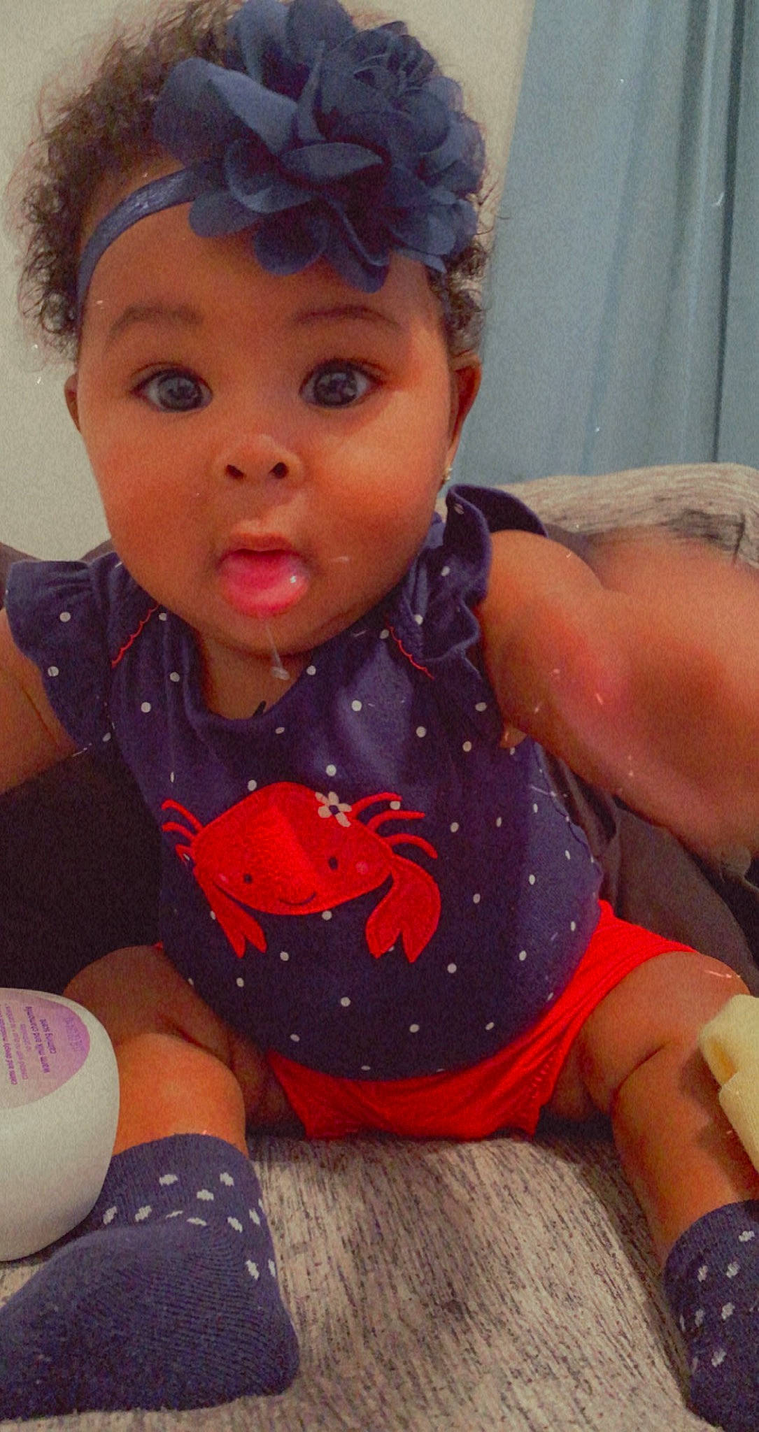 Dalani joined the competition — help win amazing prizes! baby, baby_toddler_clothing, cheek, child, child_model, costume_accessory, curtain, hair_accessory, headband, headpiece, overall, person, polka_dot, surprise, toddler