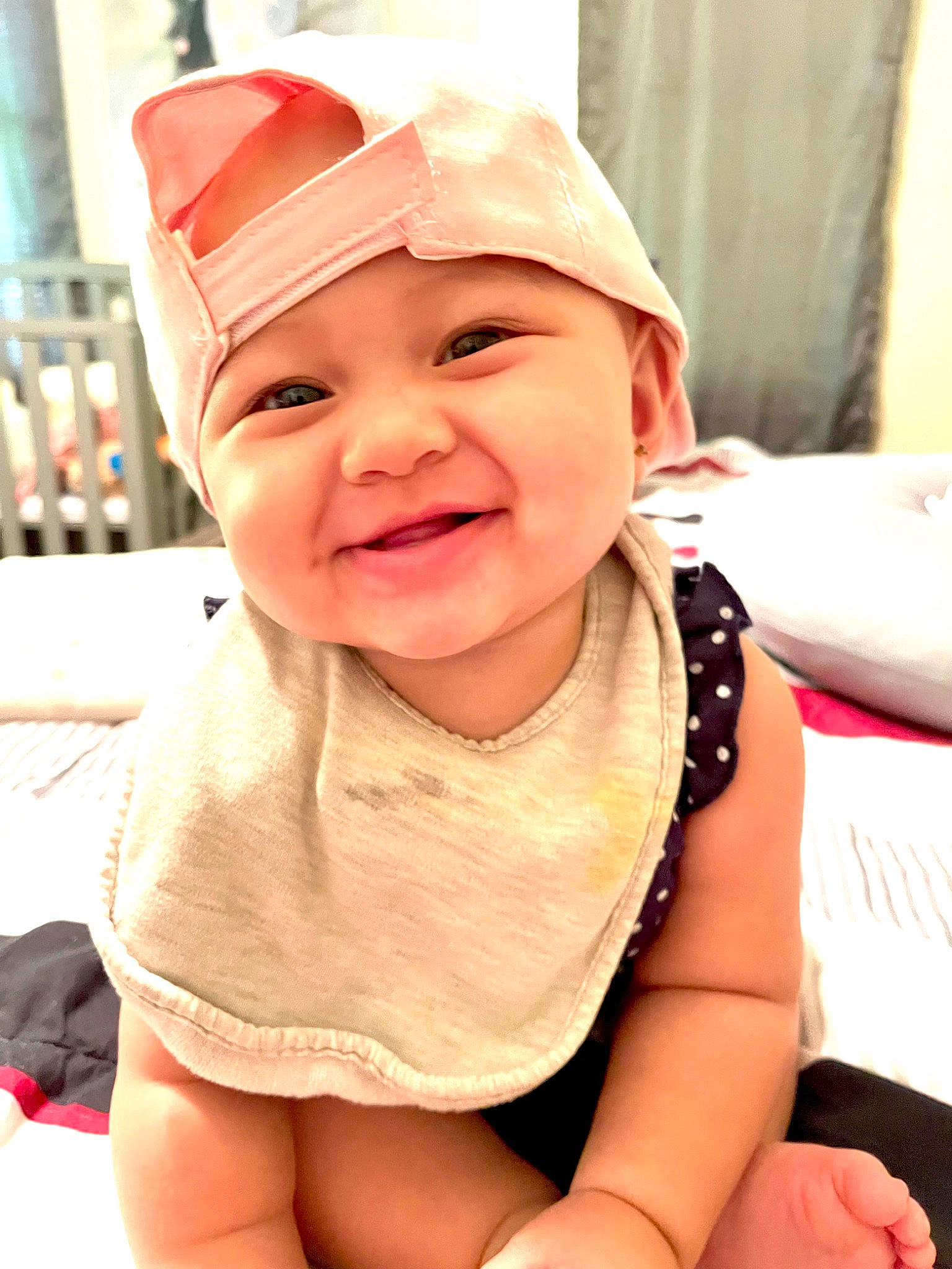 Alyssa is registered to the contest to win money with this photo: baby, baby_laughing, baby_toddler_clothing, baseball_cap, cap, cheek, child, chin, eye, fun, happy, hat, head, headwear, human_body, joy, mouth, person, pink, skin