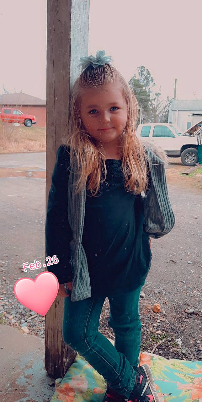 Nevaeh is registered to the contest to win money with this photo: car, child, cool, denim, fashion, hair, hairstyle, happy, head, lip, neck, outerwear, person, pink, sleeve, standing, street_fashion, tree, waist, wheel