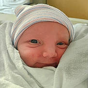 Lincoln joined the competition — help win amazing prizes! newborn, baby, infant, face, hat, blanket, wrapped, closeup, portrait, skin, cute, sleepy, soft, indoors, child, person, headwear, newborn_hat, baby_clothes, resting