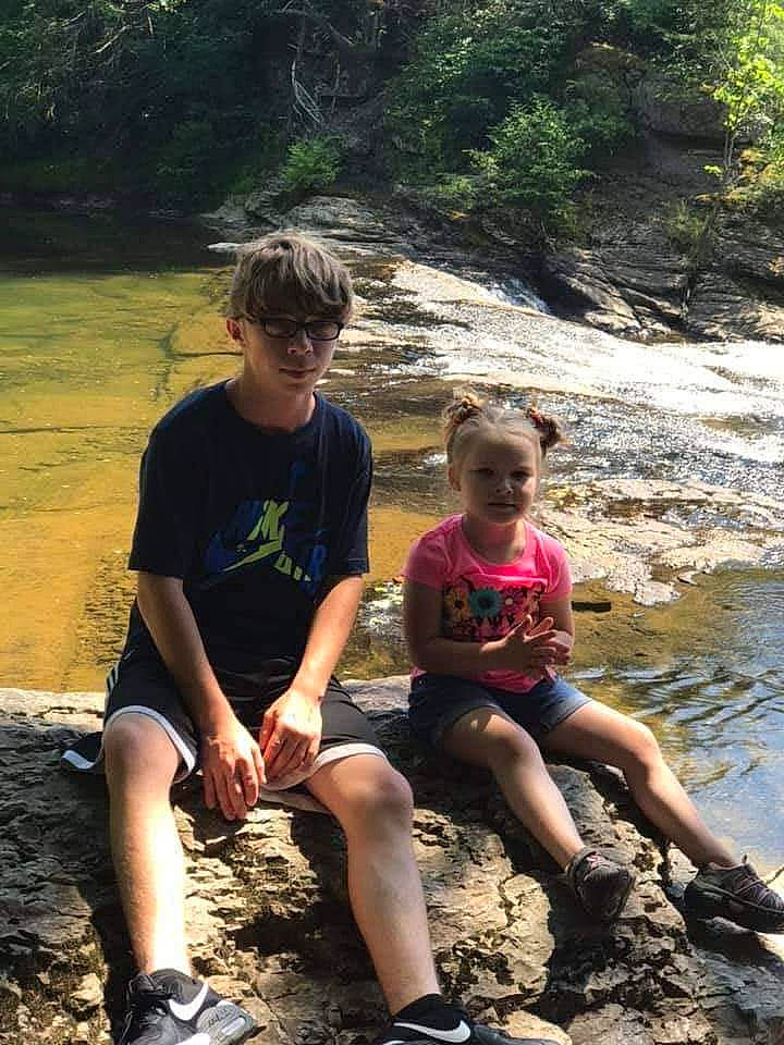 Madalynn is registered to the contest to win money with this photo: adaptation, bedrock, botany, footwear, fun, leg, leisure, mammal, outdoor_recreation, people, people_in_nature, person, shoe, shorts, sneakers, summer, tree, vertebrate, water, watercourse