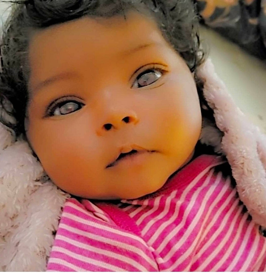 Razan is registered to the contest to win money with this photo: baby, baby_toddler_clothing, beauty, black_hair, cheek, child, close_up, ear, eyebrow, eyelash, flash_photography, happy, human_body, iris, lip, nose, organ, person, skin, textile