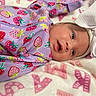 Aaliyah Rose joined the competition — help win amazing prizes! applique, architecture, baby, bed, blanket, bodypart, bonnet, building, cap, clothing, crib, face, finger, furniture, hand, happy, hat, head, hoodie, hospital