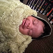 Kamrin is registered to the contest to win money with this photo: baby, blanket, child, closeup, comfort, cozy, crib, cushion, face, homedecor, hood, indoor, infant, peaceful, portrait, relaxation, rest, sleeping, soft, toy