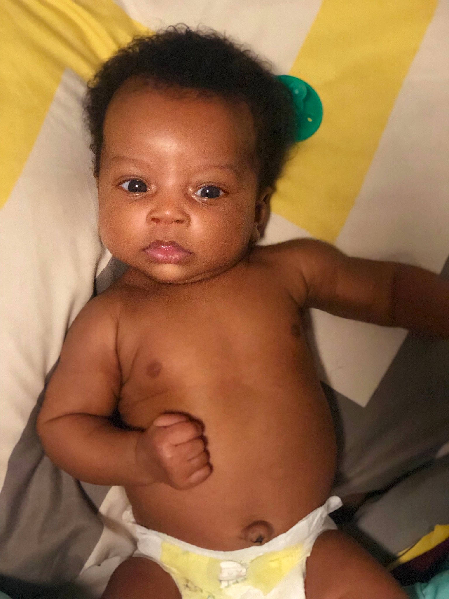 Janiyah is registered to the contest to win money with this photo: abdomen, arm, baby, barechested, black_hair, cheek, chest, child, diaper, eye, face, head, lip, mouth, muscle, neck, person, skin, stomach, toddler