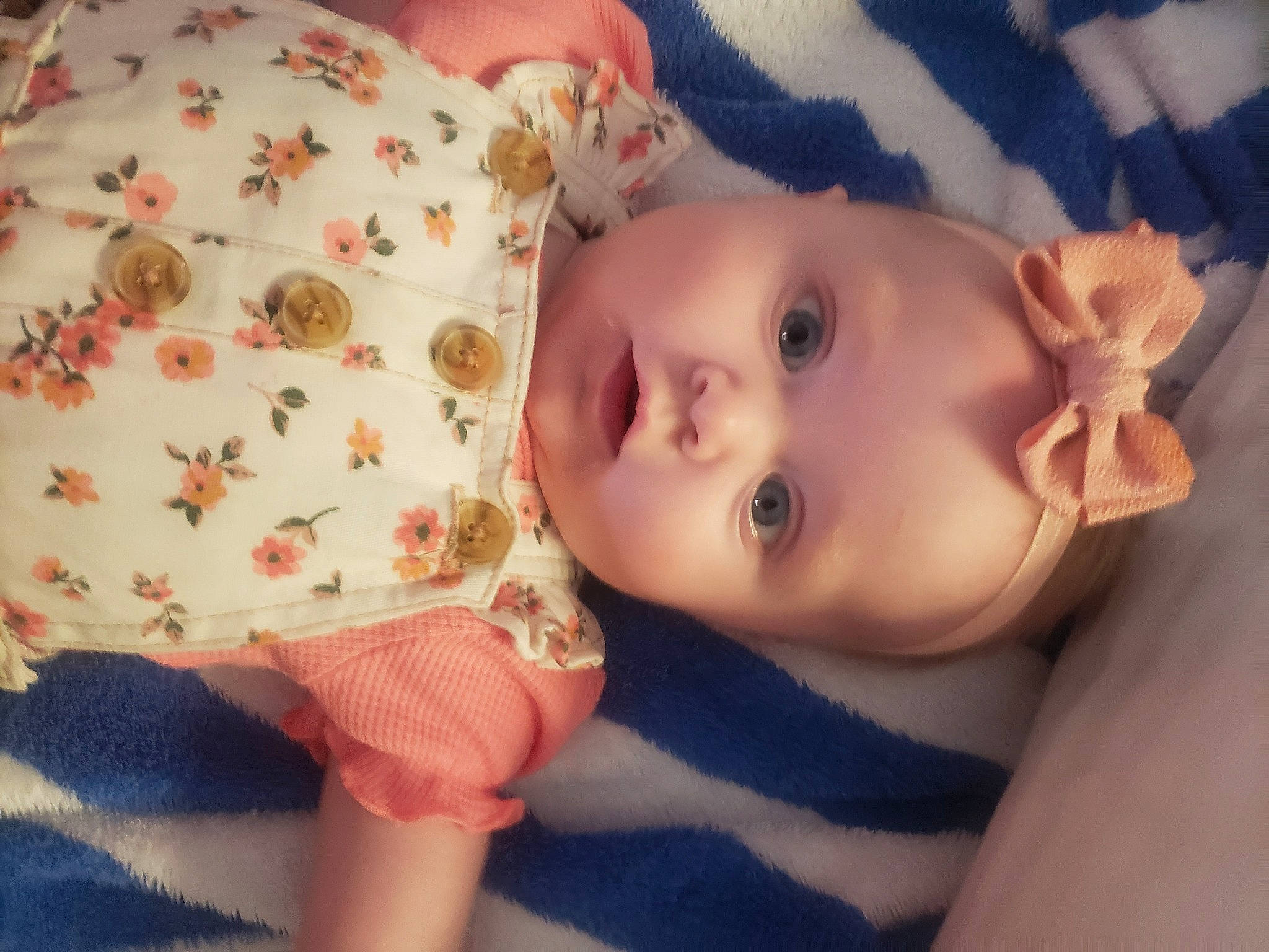 Leslie is registered to the contest to win money with this photo: baby, baby_toddler_clothing, cheek, dress, eye, eyelash, face, facial_expression, finger, hand, headgear, human_body, lip, mouth, neck, nose, person, pink, skin, sleeve