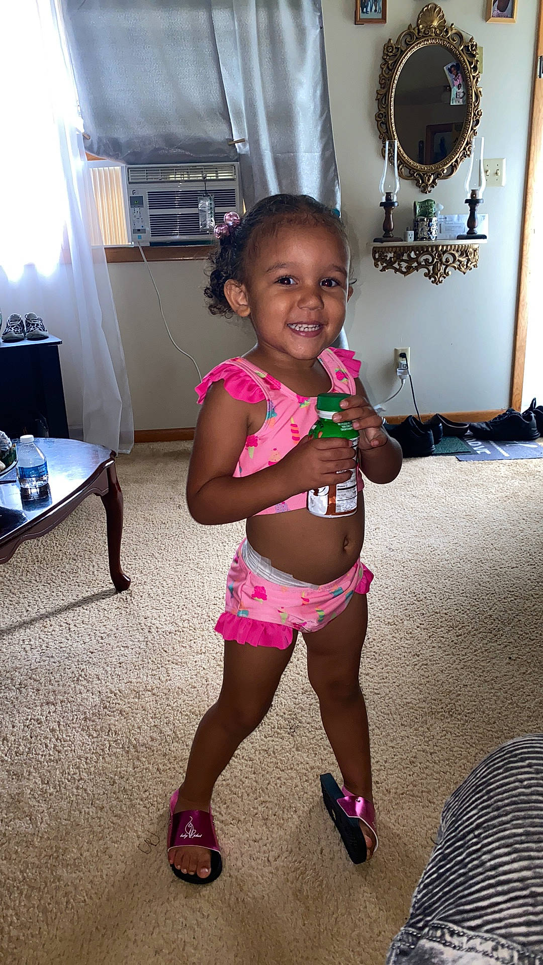 Kay'Leigh is registered to the contest to win money with this photo: abdomen, black_hair, child, electronic_device, fun, human_leg, joint, joy, leg, person, pink, play, room, shoulder, smile, summer, technology, thigh, toddler, trunk