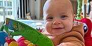 Oscar joined the competition — help win amazing prizes! baby, child, smiling, indoor, toy, play_station, colorful, face, clothing, person, happy, infant, cute, closeup, playtime, young_child, fun, bright, hand, seat