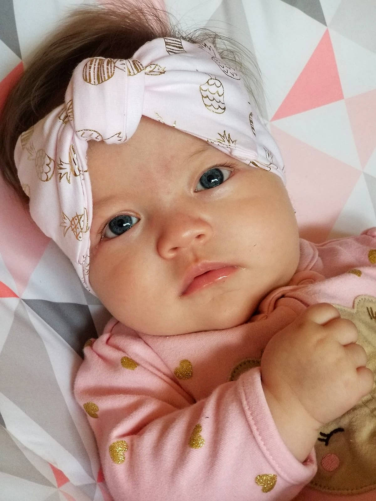 Anabella is registered to the contest to win money with this photo: baby, cheek, child, eye, face, forehead, hair_accessory, head, headgear, lip, person, photography, pink, skin, toddler