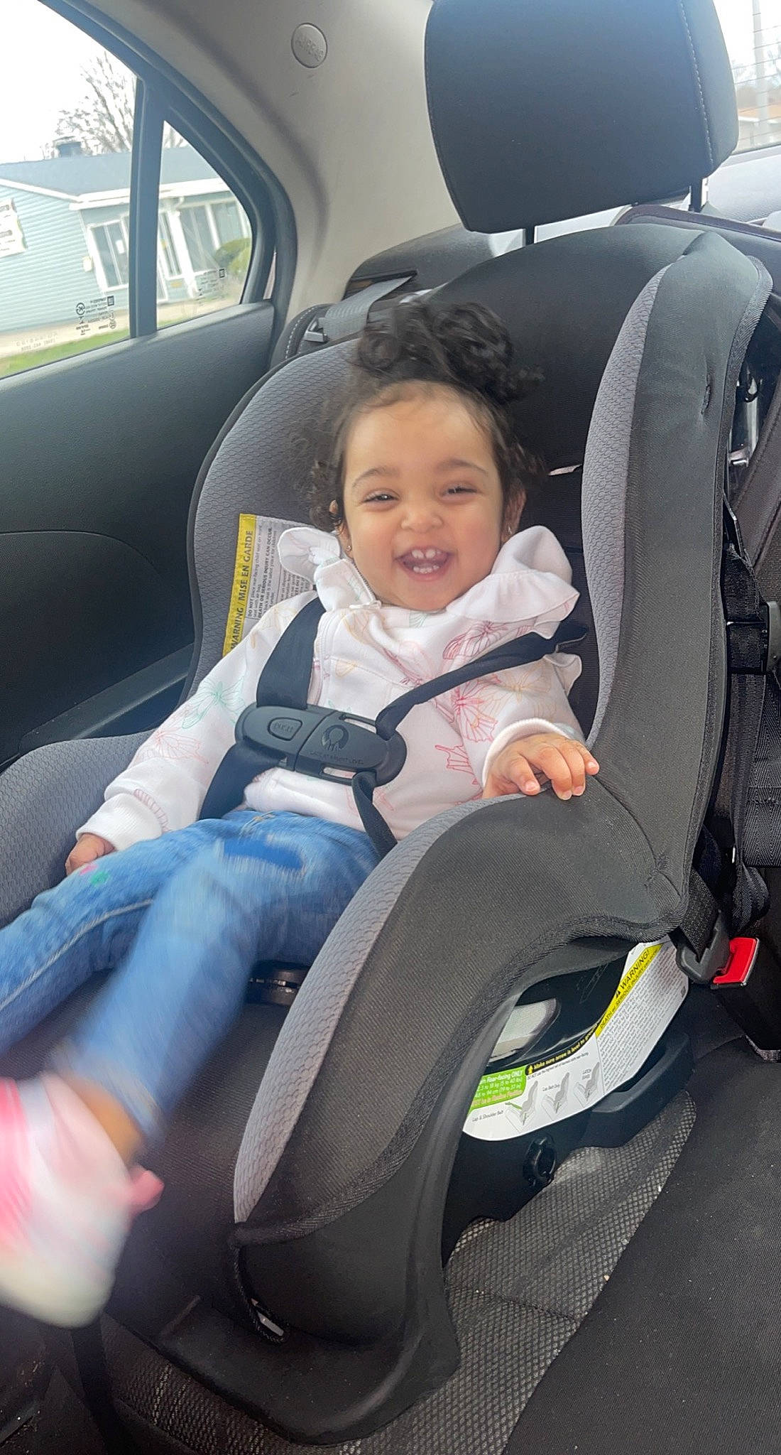 Aubri is registered to the contest to win money with this photo: auto_part, automotive_design, automotive_exterior, automotive_tire, automotive_wheel_system, car, car_seat, car_seat_cover, comfort, head_restraint, mode_of_transport, motor_vehicle, person, personal_luxury_car, plant, smile, steering_part, toddler, vehicle, vehicle_door