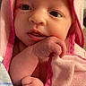 Ensley is registered to the contest to win money with this photo: baby, infant, towel, pink, hooded_towel, skin, face, hand, cute, newborn, portrait, wrapped, closeup, child, sleepwear, soft, expression, young, person, indoor