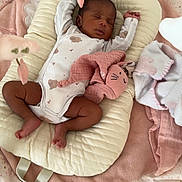 Eliyah participe au concours pour gagner de l'argent avec cette photo : baby, baby_lounger, blanket, child, clothing, comfort, cozy, cute, fabric, floor, indoor, infant, newborn, pink, plush_toy, resting, sleeping, soft_toys, star_pattern, white